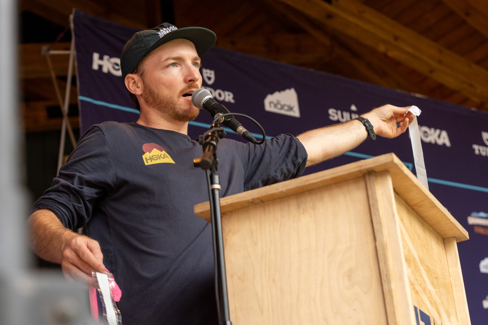Nick Edwards giving the athlete briefing at the podium at Grindstone Trail Running Festival by UTMB