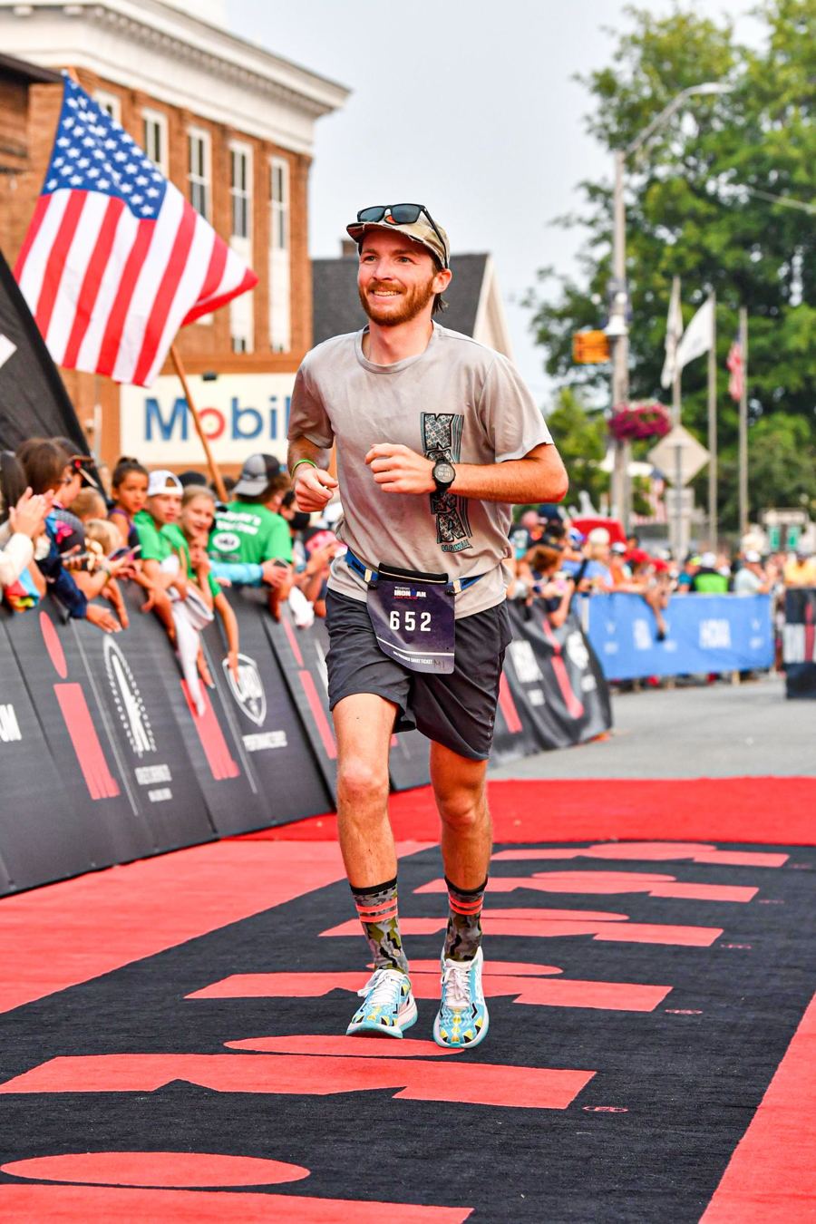 Crossing the finish carpet at IRONMAN Lake Placid